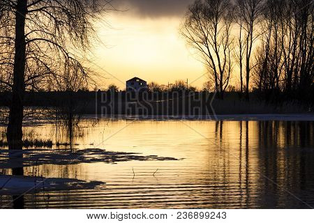 Mystical Picture Of The House And Silhouettes Of Trees In The Water, Spring And Plants