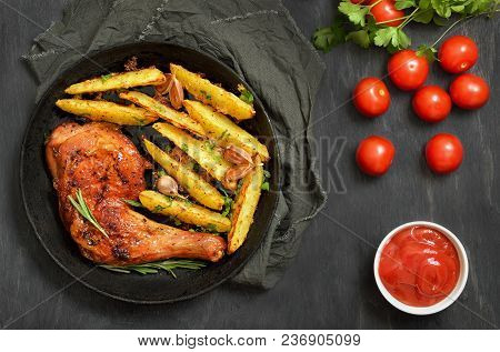 Grilled Chicken Leg With Herbs And Fried Potatoes In Frying Pan, Top View