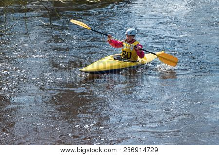 Grodno, Belarus - April, 2018: Kayak Freestyle Competition On Fast Cold Water River Strenuously Rowi