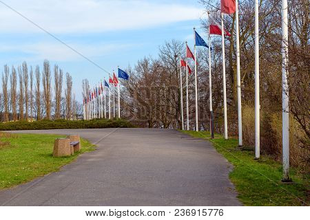 Gdansk Westerplatte, Poland - April 15, 2018: Masts With Flags Along The Road Near Westerplatte Monu