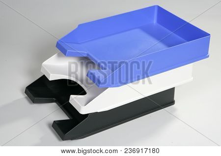 Empty Plastic Document Trays Stacked On Top Of Each Other