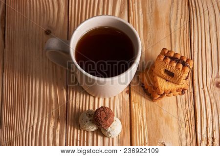 Cup Of Tea With Tasty Cookies On Wooden Background