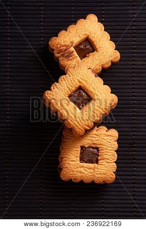 Chocolate Cookies On Gray Plate On Black Wooden Table