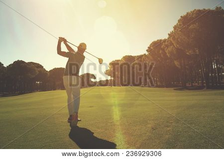 pro golf player shot ball from sand bunker at course