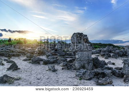 Magnificent Landscape Of Abstract Stones On A Hill At Sunset.