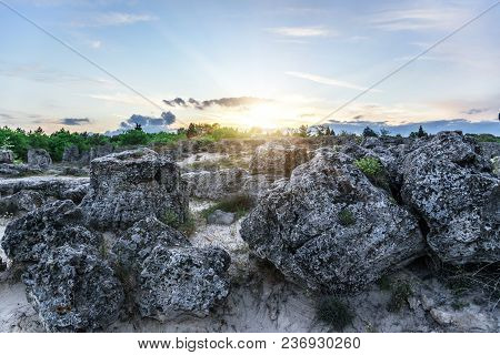 Magnificent Landscape Of Abstract Stones On A Hill At Sunset.
