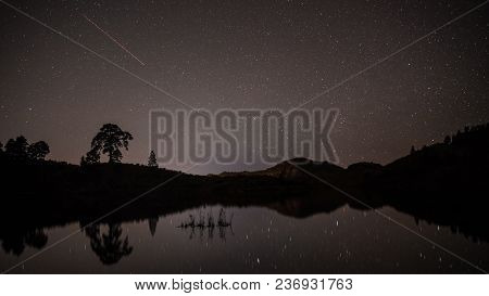Image Of A Sky Full Of Stars In Gran Canaria, Spain. Reflection Of The Sky On The Lake