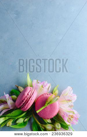 Macaroon Cookies Flat Lay With Spring Blossom On A Blue Stone Background With Copy Space. French Des