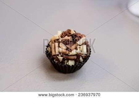 Brazilian Typical Regional Dessert Called Brigadeiro, With White An Black Cholocate Covering.