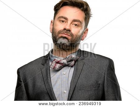 Middle age man, with beard and bow tie with sleepy expression, being overworked and tired isolated over white background