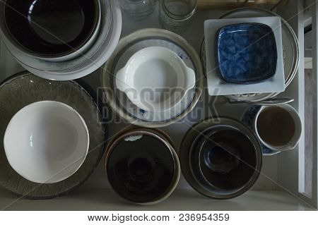 Pile Of Plate And Bowl In Box. Empty Plate And Bowl.