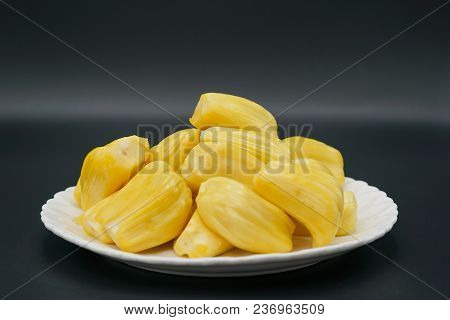 Fresh Jackfruit Slices On A White Plate. Sweet Yellow Jackfruit Ripe. Vegetarian, Vegan, Raw Food. E