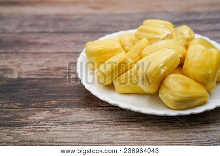Fresh Jackfruit Slices On A White Plate. Sweet Yellow Jackfruit Ripe. Vegetarian, Vegan, Raw Food. E
