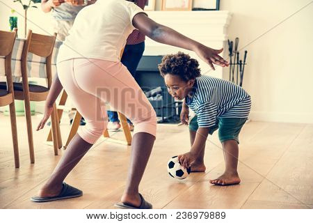 Kids playng ball indoors together