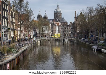 Amsterdam, Holland - 14 April 2018 Basilica Of St. Nicholas On The Prins Hendrikkade Street. It Is T