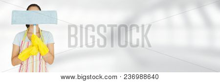 Cleaner hiding behind mop with bright background