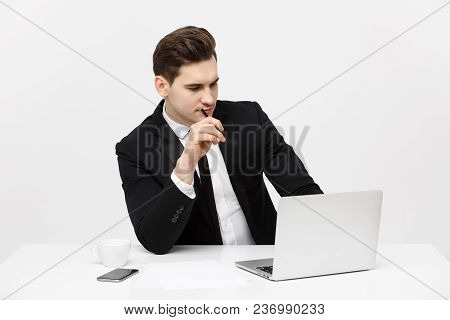 Portrait Of Confident Manager Sitting At Desk. Portrait Of Business Man Working At Computer. Success
