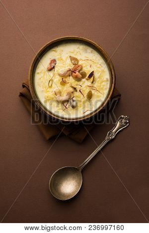 Kheer Or Rice Pudding Is An Indian Dessert In A Brown Terracotta Bowl With Dry Fruits Toppings