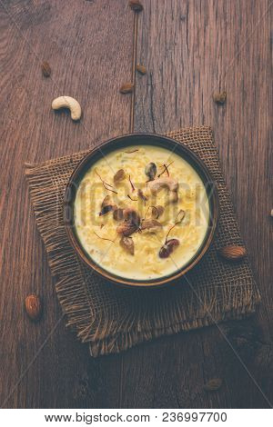 Kheer Or Rice Pudding Is An Indian Dessert In A Brown Terracotta Bowl With Dry Fruits Toppings