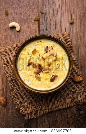 Kheer Or Rice Pudding Is An Indian Dessert In A Brown Terracotta Bowl With Dry Fruits Toppings
