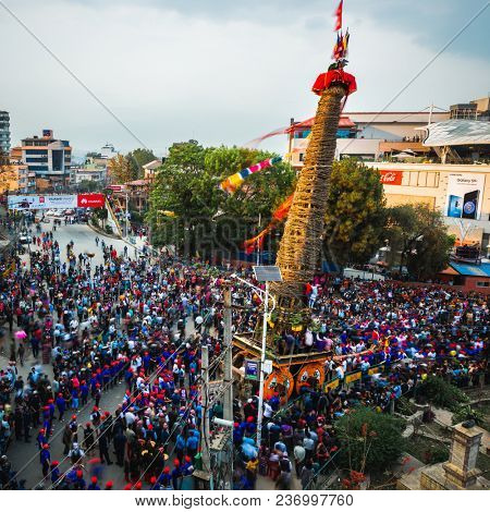 PATAN, NEPAL - APRIL 19, 2018: First day of Rato Machhindranath festival. Rato Machhindranath is a Hindu and Buddhist deity worshipped as the God of Rain. 