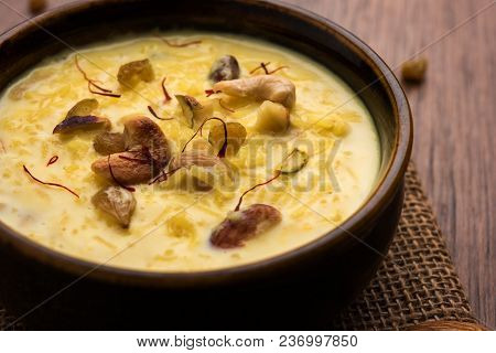 Kheer Or Rice Pudding Is An Indian Dessert In A Brown Terracotta Bowl With Dry Fruits Toppings
