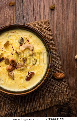 Kheer Or Rice Pudding Is An Indian Dessert In A Brown Terracotta Bowl With Dry Fruits Toppings