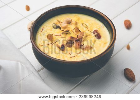 Kheer Or Rice Pudding Is An Indian Dessert In A Brown Terracotta Bowl With Dry Fruits Toppings