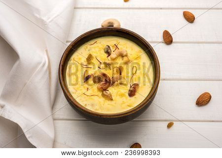 Kheer Or Rice Pudding Is An Indian Dessert In A Brown Terracotta Bowl With Dry Fruits Toppings
