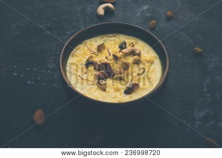 Kheer Or Rice Pudding Is An Indian Dessert In A Brown Terracotta Bowl With Dry Fruits Toppings