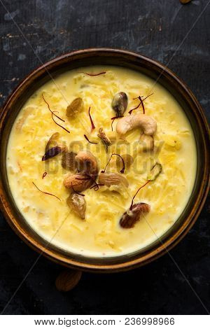 Kheer Or Rice Pudding Is An Indian Dessert In A Brown Terracotta Bowl With Dry Fruits Toppings