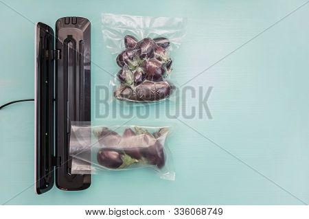 Plastic Sealing Machine. Vacuum Packaging Of Fresh Tomatoes. Vacuum Packaging Fresh Eggplant For Sto