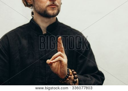 Hand With Rosary Shows The Mudra Of Life. Qigong. Yoga. Close Up. Hands Folded In Prayer. Hands Toge