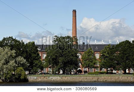 Pori Finland 06/27/2019 An Old Cotton Mill Stands On The Banks Of The Kokemaki River On A Beautiful 