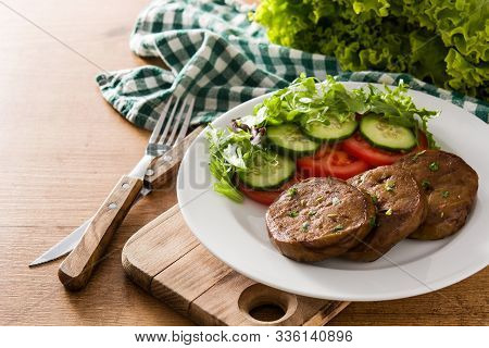 Seitan With Vegetables On Wooden Table. Fake Meat.