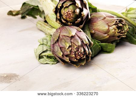 Artichokes On Grey Background. Fresh Raw Organic Artichoke Flower.