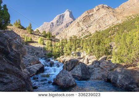 Beautiful Mountain Landscape In The Summer Morning. Fann Mountains, Tajikistan. Mountain River In Pa