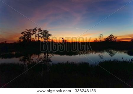 Louisiana Swamp Sunset Silhouette And Reflections