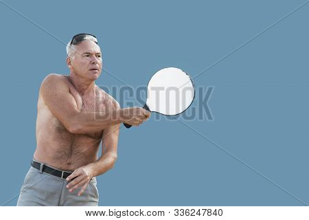 Adult Man With A Racket In His Hand