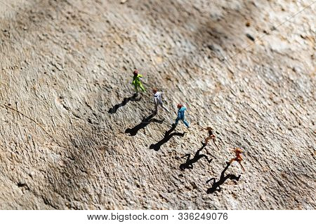 Miniature People : Group Of People Are Running  On Concrete Floor