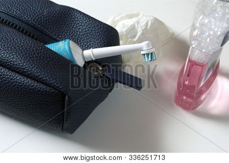 Stdio Close-up Of A Travel Bag, Toothbrush And Mouthwash Liquid