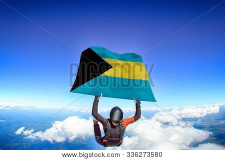 Bahamas Extreme. Flag In Skydiving. People In Free Fall Grab Flag Of Bahamas. Patriotism, Men And Fl