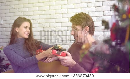 White Couple Exchange Presents For Holiday Season