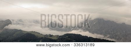 Panoramic View Of An Alpine Landscape In Cloudy Weather