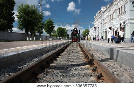Moscow, Russia - June 07, 2017: Green Retro Steam Locomotive Standing On The Railways In The Distanc
