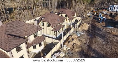 House With A Roof From A Bituminous Tile. Bituminous Tile For A Roof. A Roof From A Bituminous Tile.