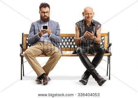 Bearded man and a punker sitting on a bench and typing on mobile phones isolated on white background