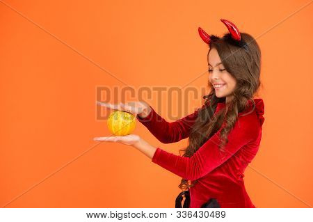 Have Magic Halloween. Little Demon Child Cast Magic Spell Upon Pumpkin. Pumpkin Is Magic Vegetable. 