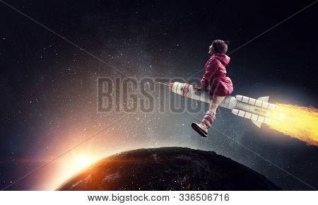 Little girl draeming to fly the moon
