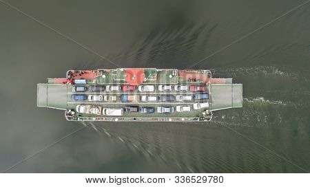 Top Down View Of Ferryboat Sailing. Ferryboat Transferring Cars. Ferry Transfers Cars And Passengers